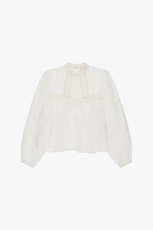 Blusa ampia con inserti di pizzo sullo scollo