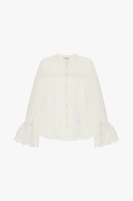 Camicia ampia con maniche volant e ricami floreali