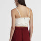 Top corto con scollo a v e bordo in pizzo