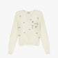 Maglione decorato con applicazioni floreali