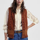 Gilet fantasia geometrica con frange