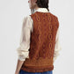 Gilet fantasia geometrica con frange
