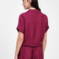 Camicia corta con nodo frontale