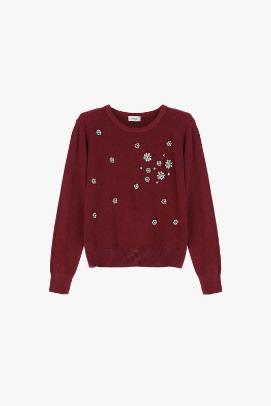 Maglione decorato con applicazioni floreali