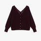 Maglione scollo a v con bottoni sul retro