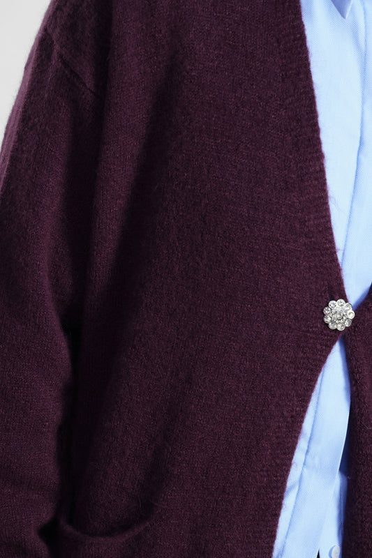 Cardigan lungo con tasche e chiusura gioiello