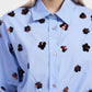 Camicia con fiori decorativi