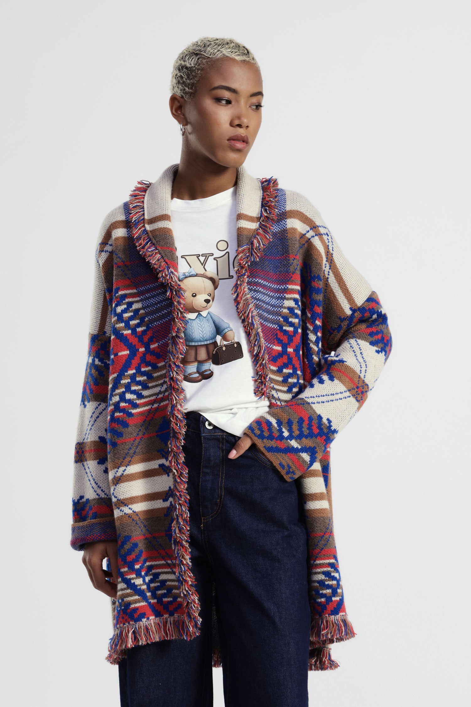 Cappotto con frange e motivo geometrico