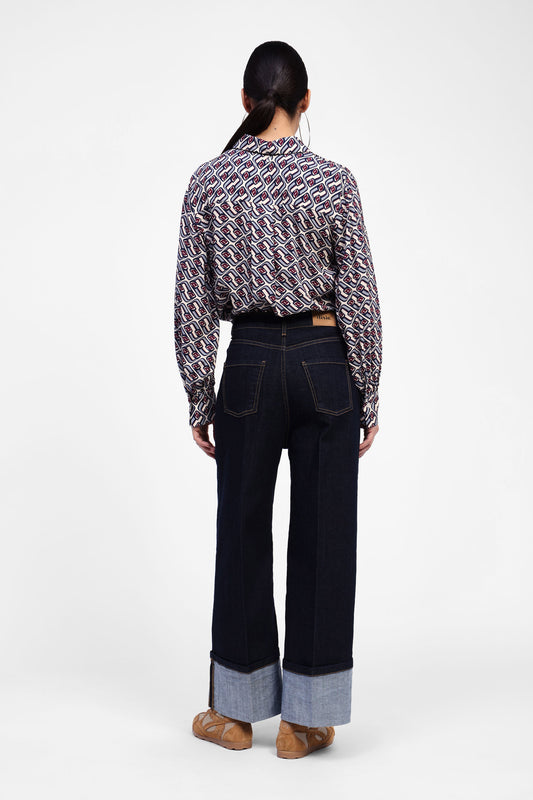 Jeans a gamba larga con risvolto