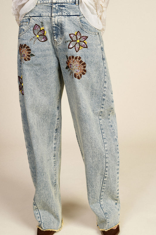 Jeans wide leg ricami floreali vita alta