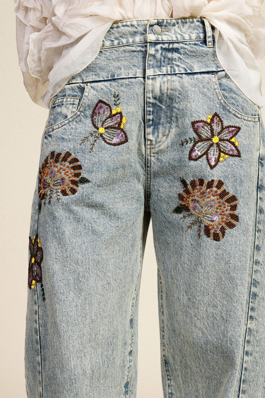 Jeans wide leg ricami floreali vita alta