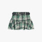 Gonna corta a quadri con cintura e balze