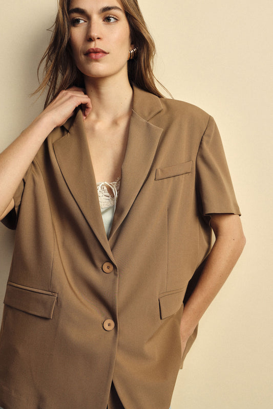 Blazer maniche corte con tasche a filetto