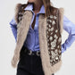 Gilet smanicato con ricamo floreale e profili pelosi