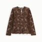 Top in pizzo trasparente manica lunga