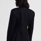 Blazer monopetto con spilla decorativa e tasche