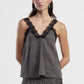 Top a pois con scollo a v e pizzo
