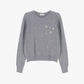 Maglione decorato con applicazioni floreali