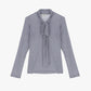 Maglia con fiocco e maniche lunghe