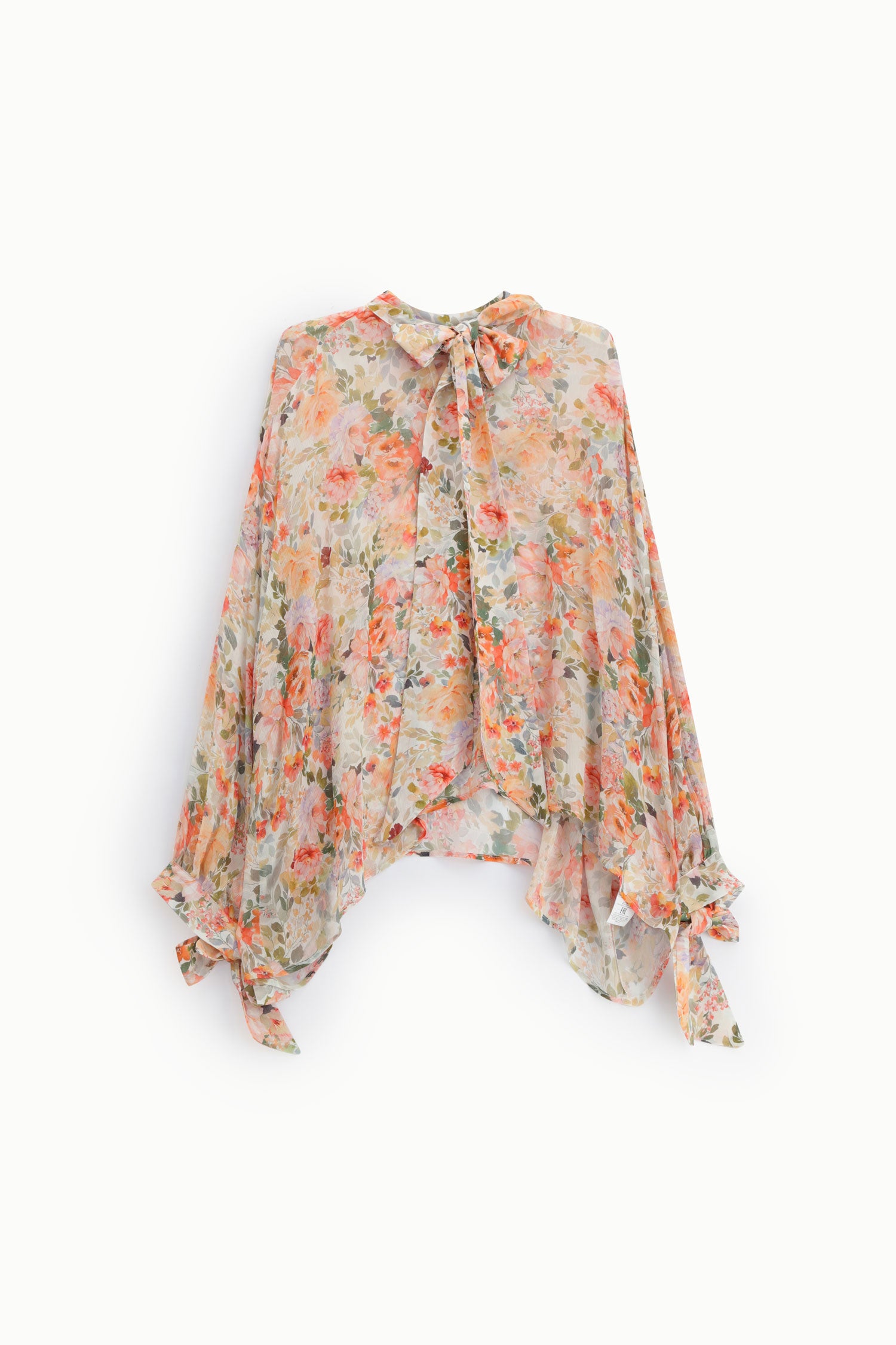 Blusa fluida fantasia floreale con fiocchi