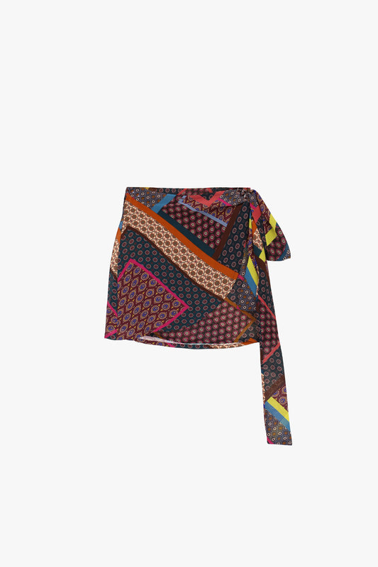 Gonna corta fantasia patchwork con nodo laterale