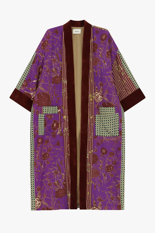 Cappotto lungo fantasia floreale con tasche a contrasto