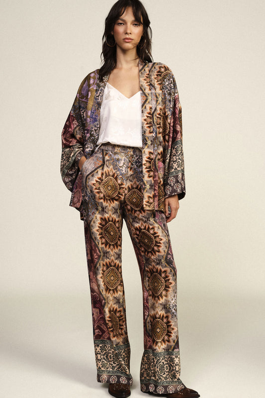 Pantaloni palazzo fantasia dettagli geometrici