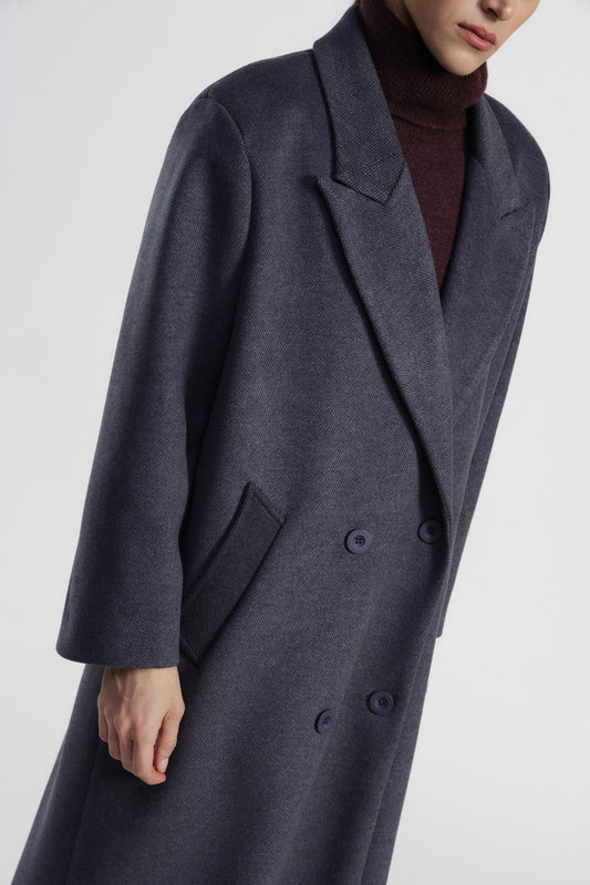 Cappotto lungo doppio petto con tasche laterali