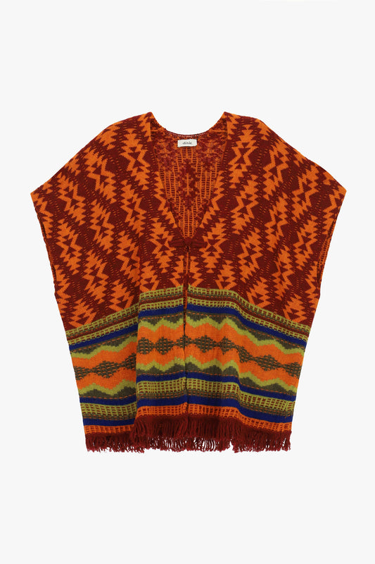 Poncho fantasia geometrica con frange