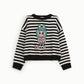 Maglione a righe con motivo cartoon frontale