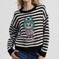 Maglione a righe con motivo cartoon frontale