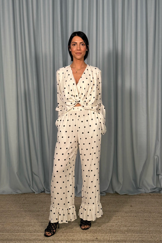 Pantaloni cropped a pois con volant fondo