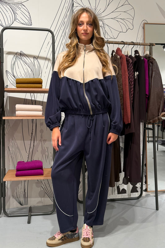 Pantaloni palazzo cropped con profili a contrasto