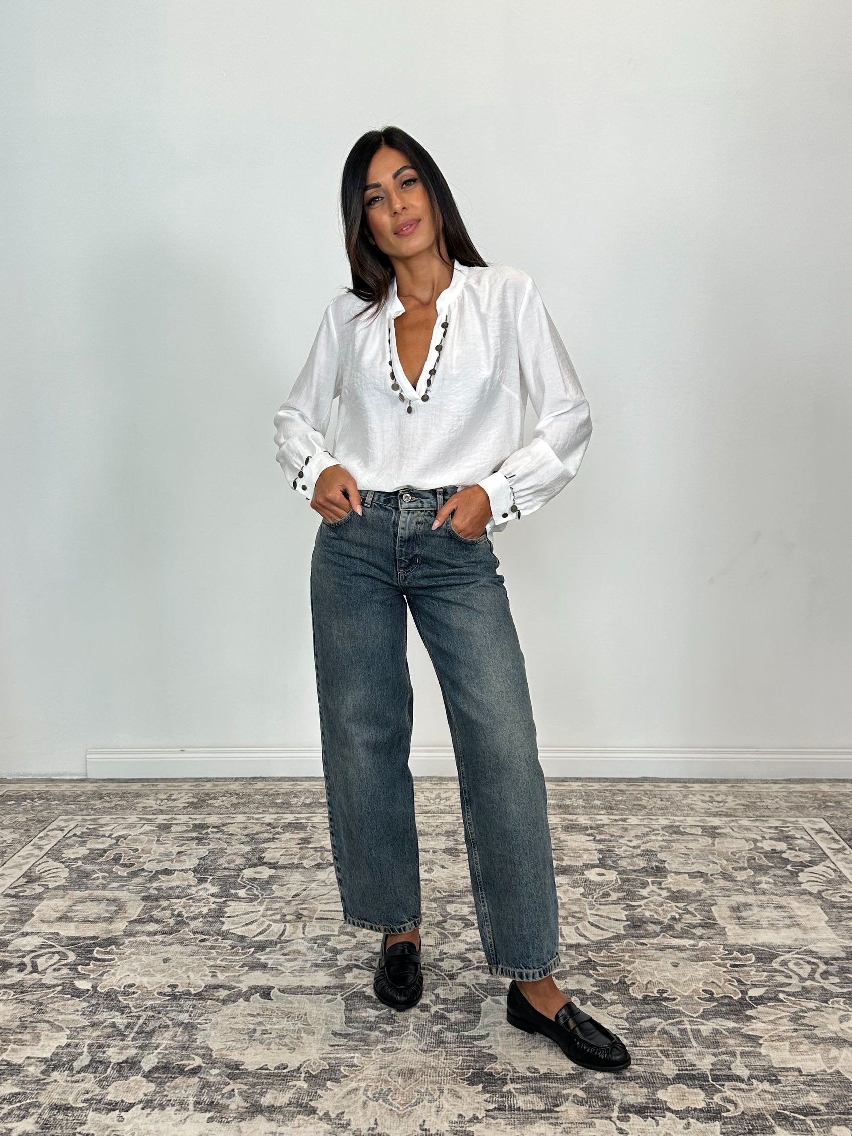 Jeans a gamba larga con vita media