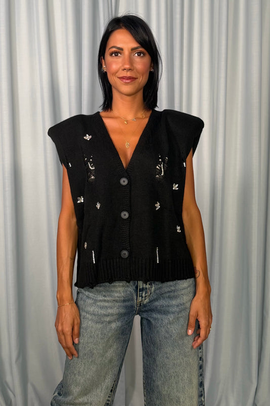 Gilet corto con strappi decorativi e bottoni