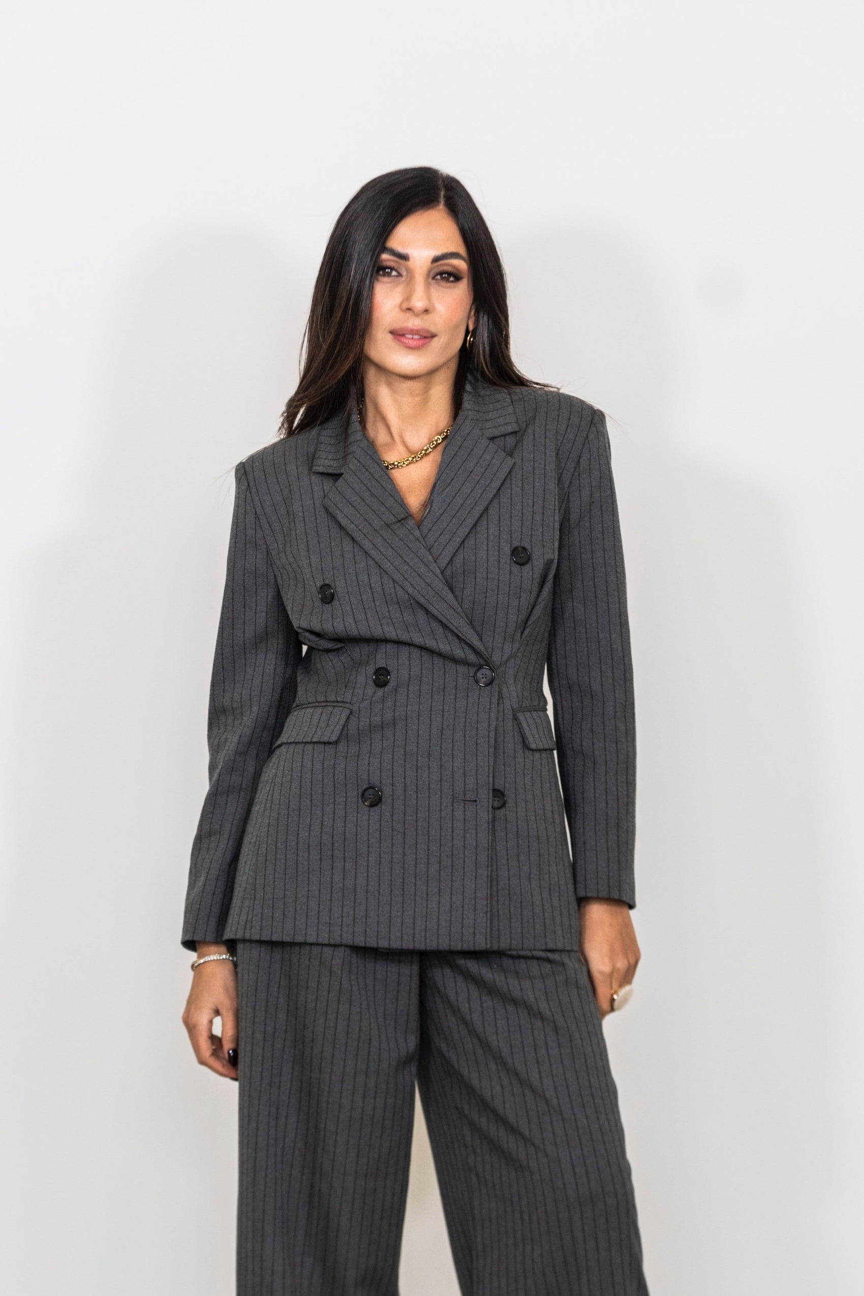 Blazer doppiopetto gessato con tasche a filetto