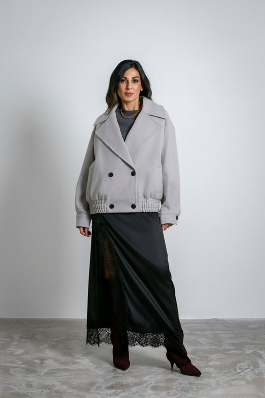 Cappotto lungo con ampio cappuccio e cintura