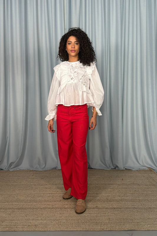 Blusa con volant e ricami in pizzo